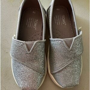 Toms girls silver sparkly shoes. Brand new never worn.